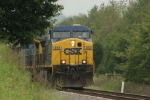 CSX 352 peeks from behind the trees as she gets her train restarted